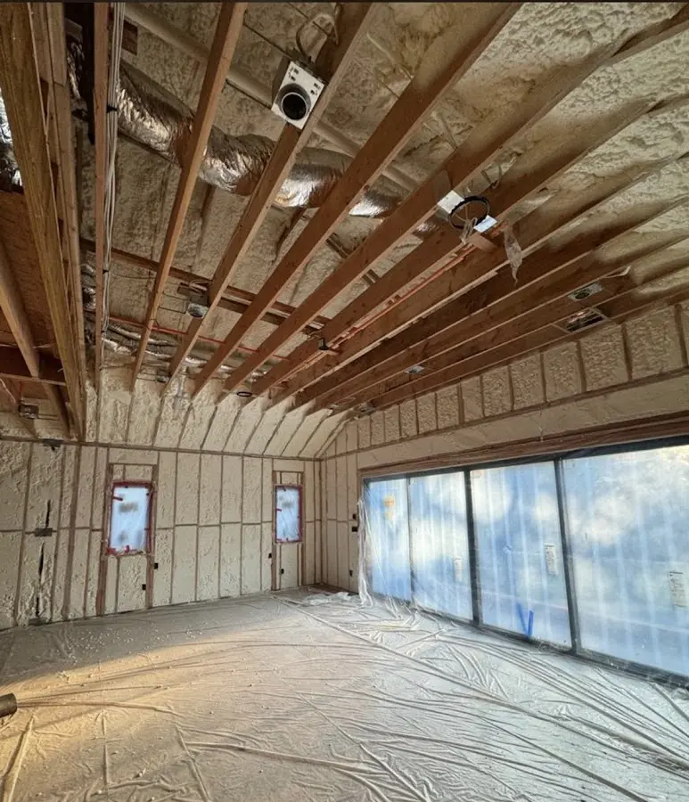 Interior walls and ceiling insulated with spray foam during new construction in Wilmington